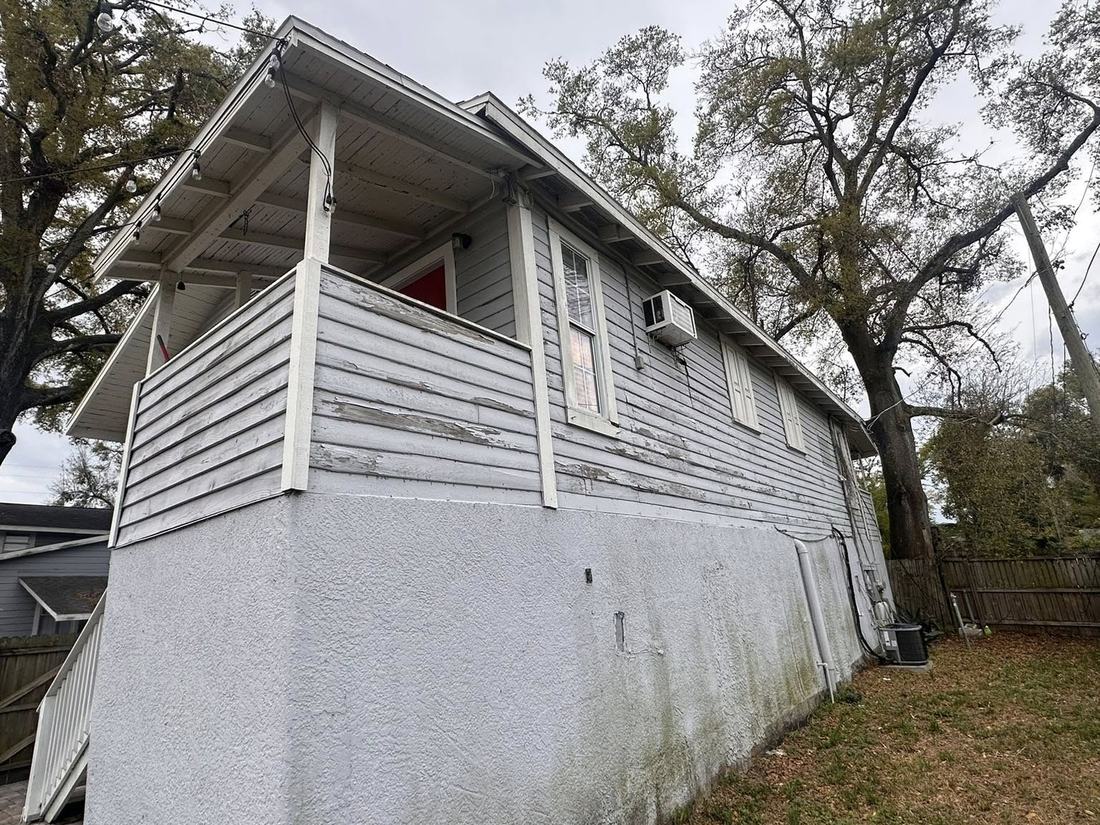 Side elevation with failed siding before work