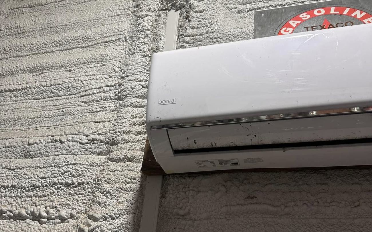 Spray foam applied around a wall penetration